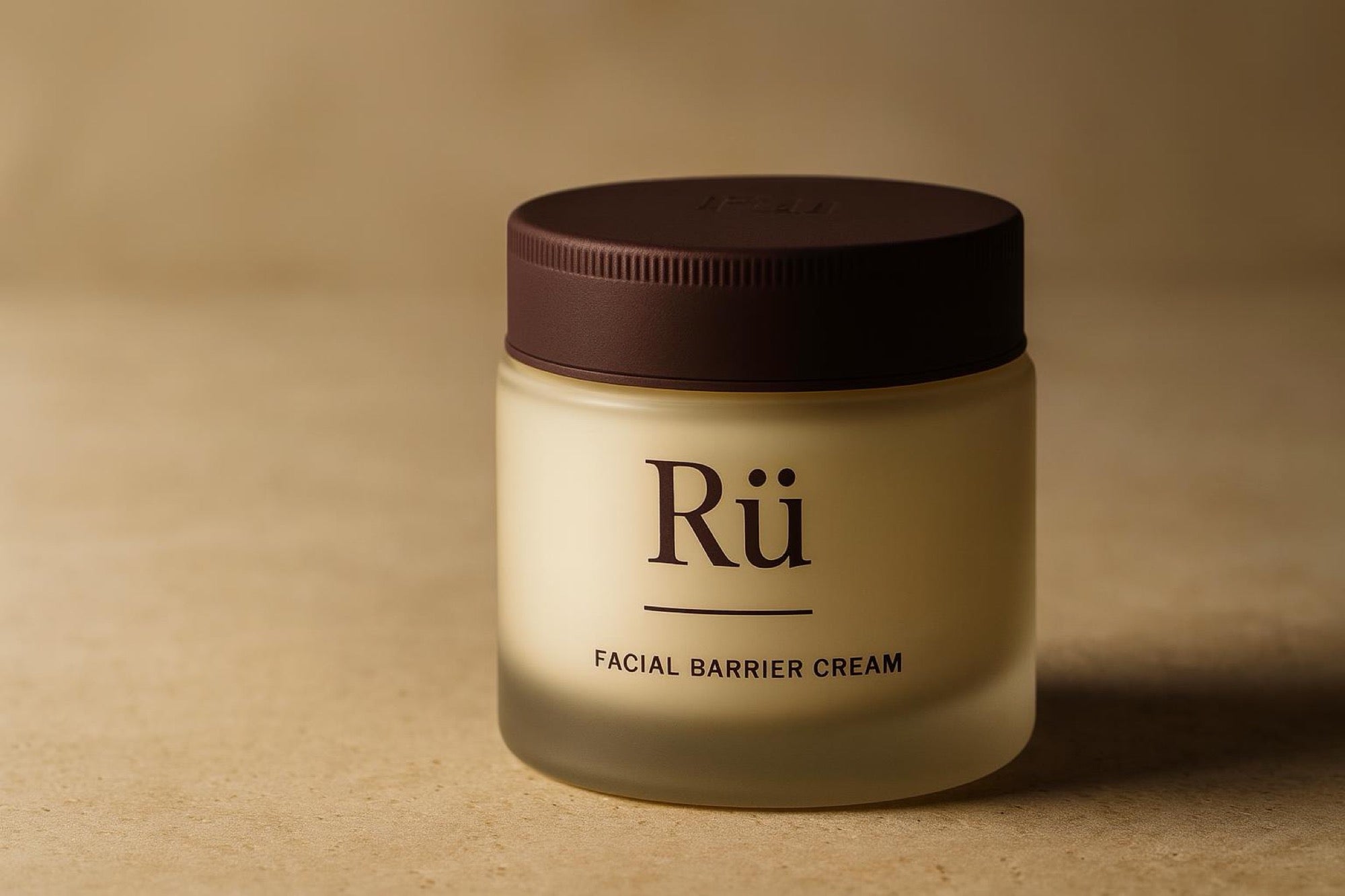 The Rü jar closed on travertine, the printed Rü label square to the camera