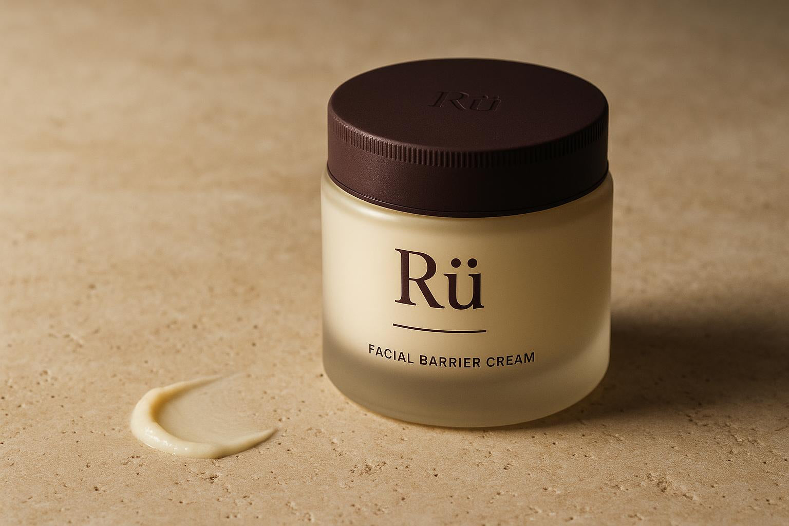 The Rü jar on a travertine ledge in raking light, lid on and the printed Rü label facing the camera, one swipe of the cream drawn across the stone beside it
